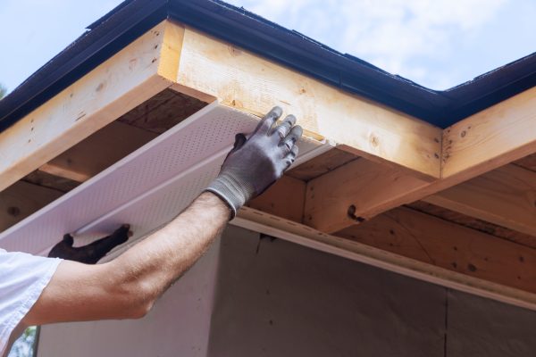An installation of upvc soffit board at corner of roof rafters ceiling